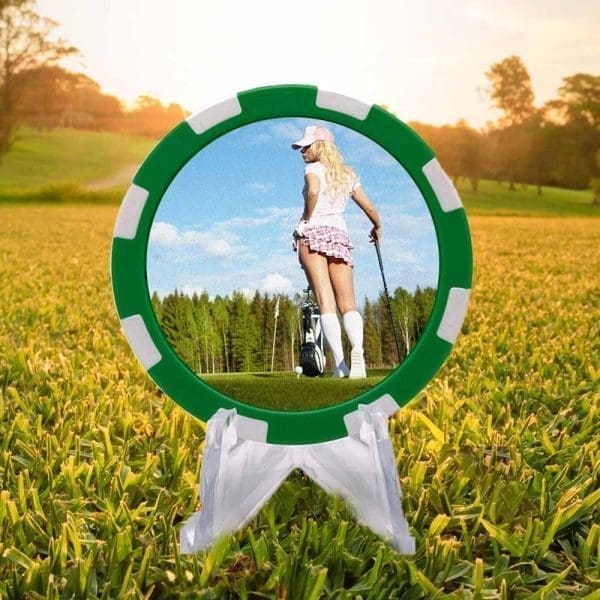 Sultry lady golfer on a green and white poker chip style golf ball marker.