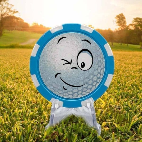 Winking golf ball light blue and white poker chip style golf ball marker.